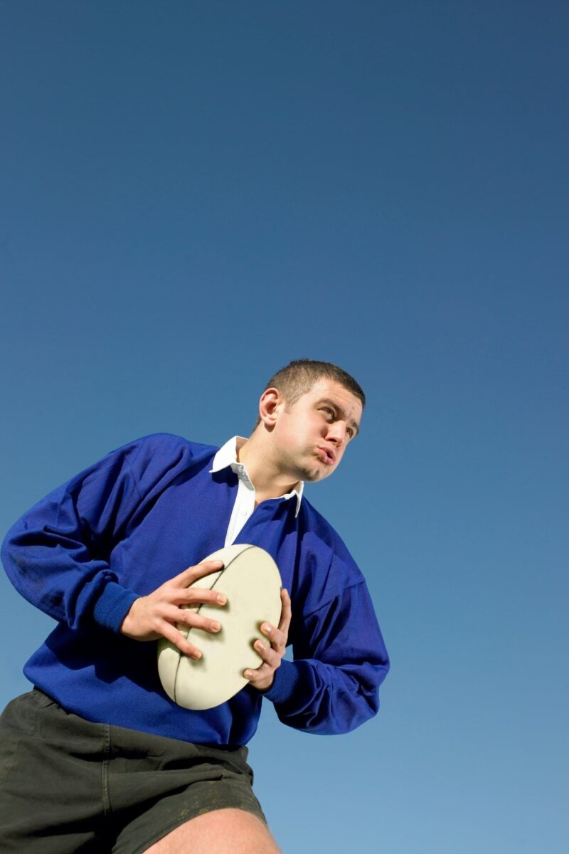 man-in-blue-jersey-holding-rugby-ball-2026-03-25-01-13-21-utc