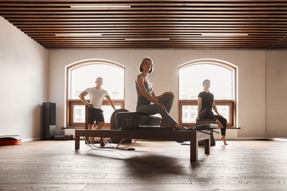 group-of-friends-doing-pilates-kneeling-glutes-exe-2026-03-16-03-39-56-utc