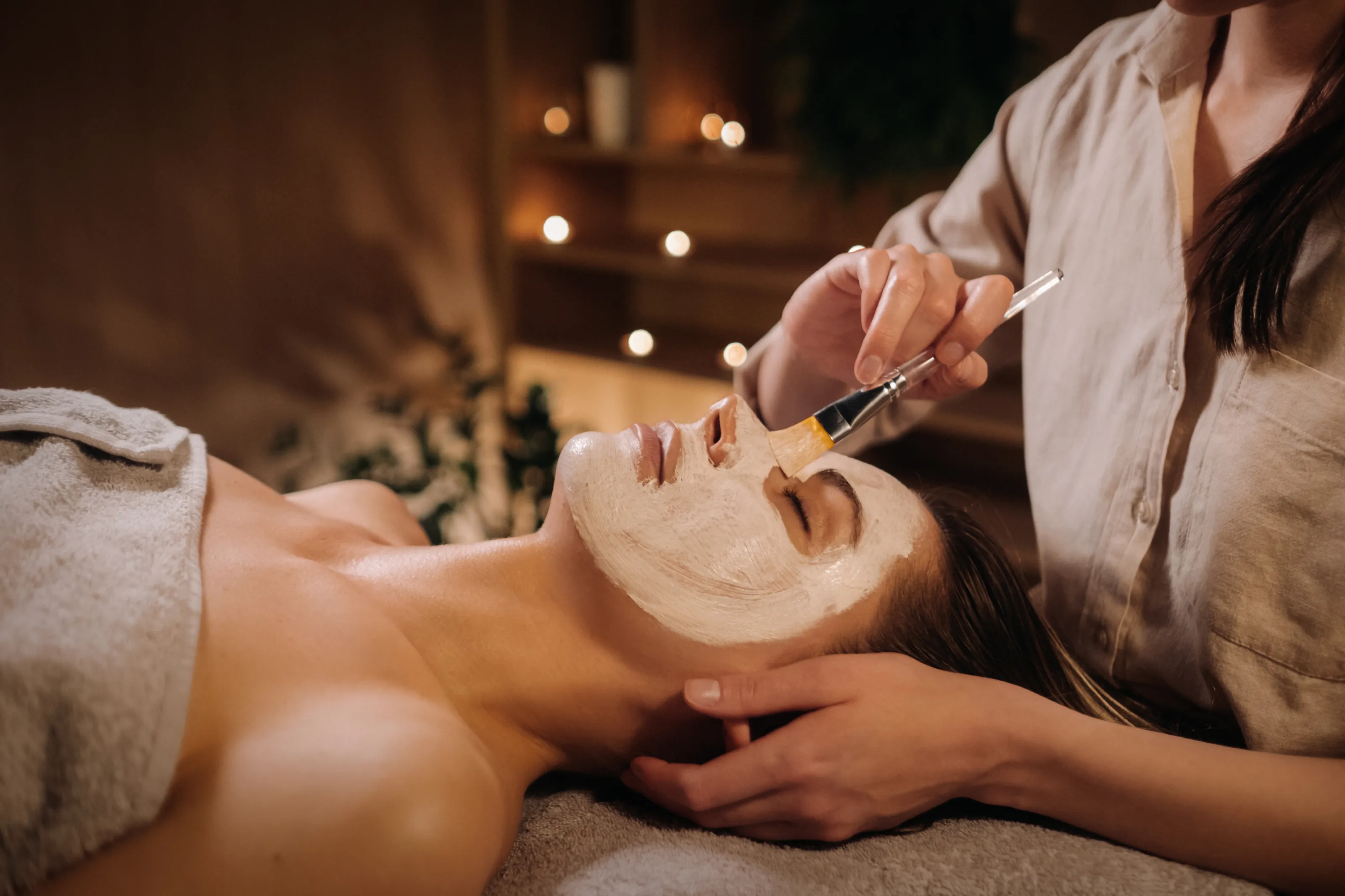 relaxing-woman-receiving-facial-mask-treatment-at-2026-01-09-08-03-49-utc