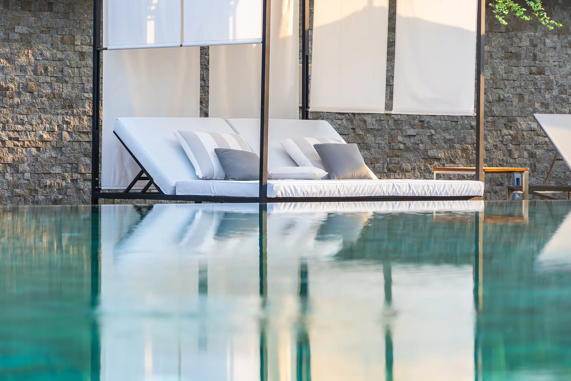 relaxing-poolside-lounger-with-elegant-stone-backd-2026-10-05-20-05-06-utc