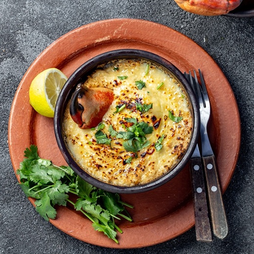 CHILEAN FOOD. Baked crabmeat crab meat with cheese, cream and bread. Traditional dish of chilean coast. Pastel o chupe de jaiba
