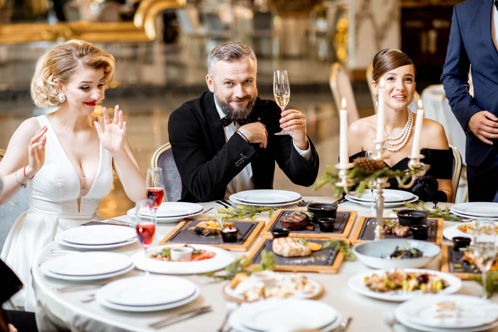 elegantly-dressed-people-having-a-festive-dinner-i-2026-01-09-06-45-46-utc
