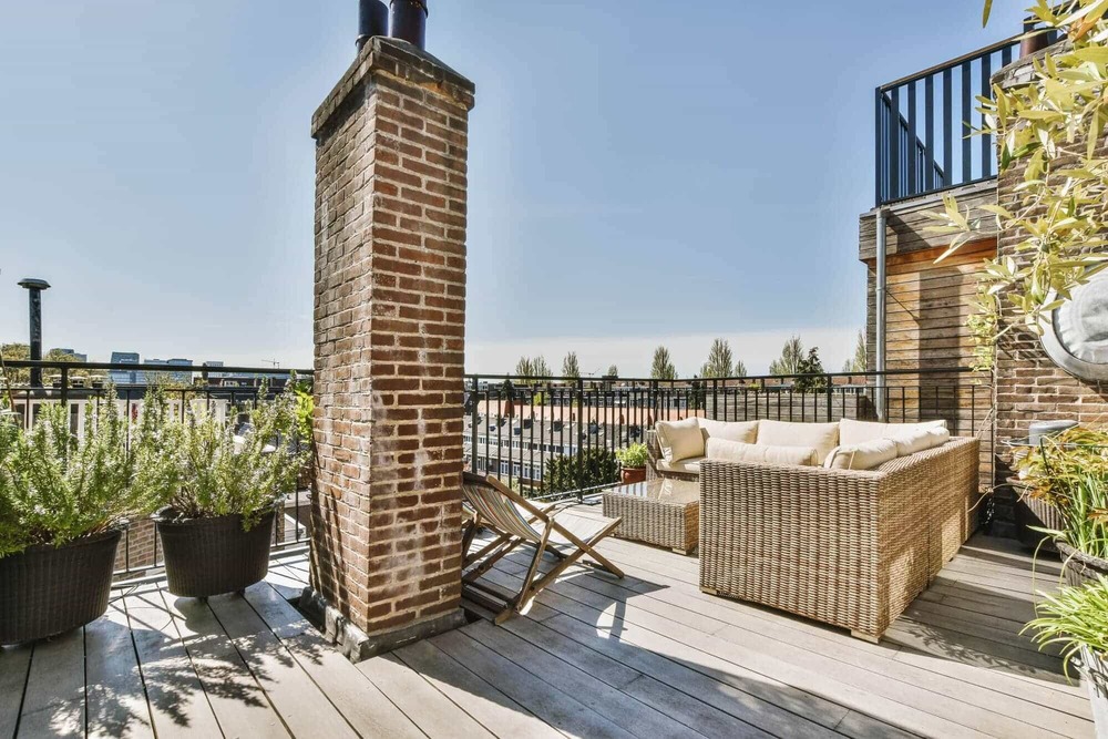 rooftop-terrace-with-brick-chimney-and-lounge-furn-2026-03-18-10-42-24-utc rooftop-terrace-with-brick-chimney-and-lounge-furn-2026-03-18-10-42-24-utc