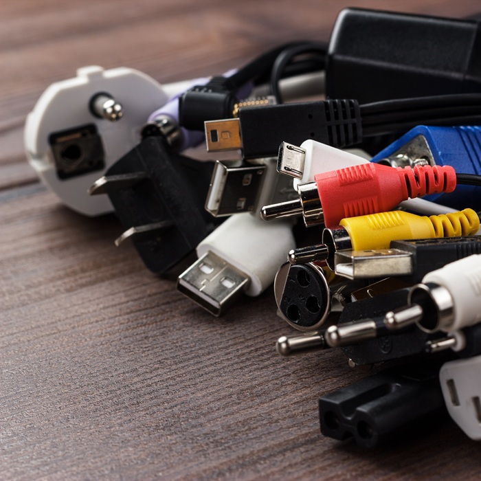 different cables on the brown wooden table