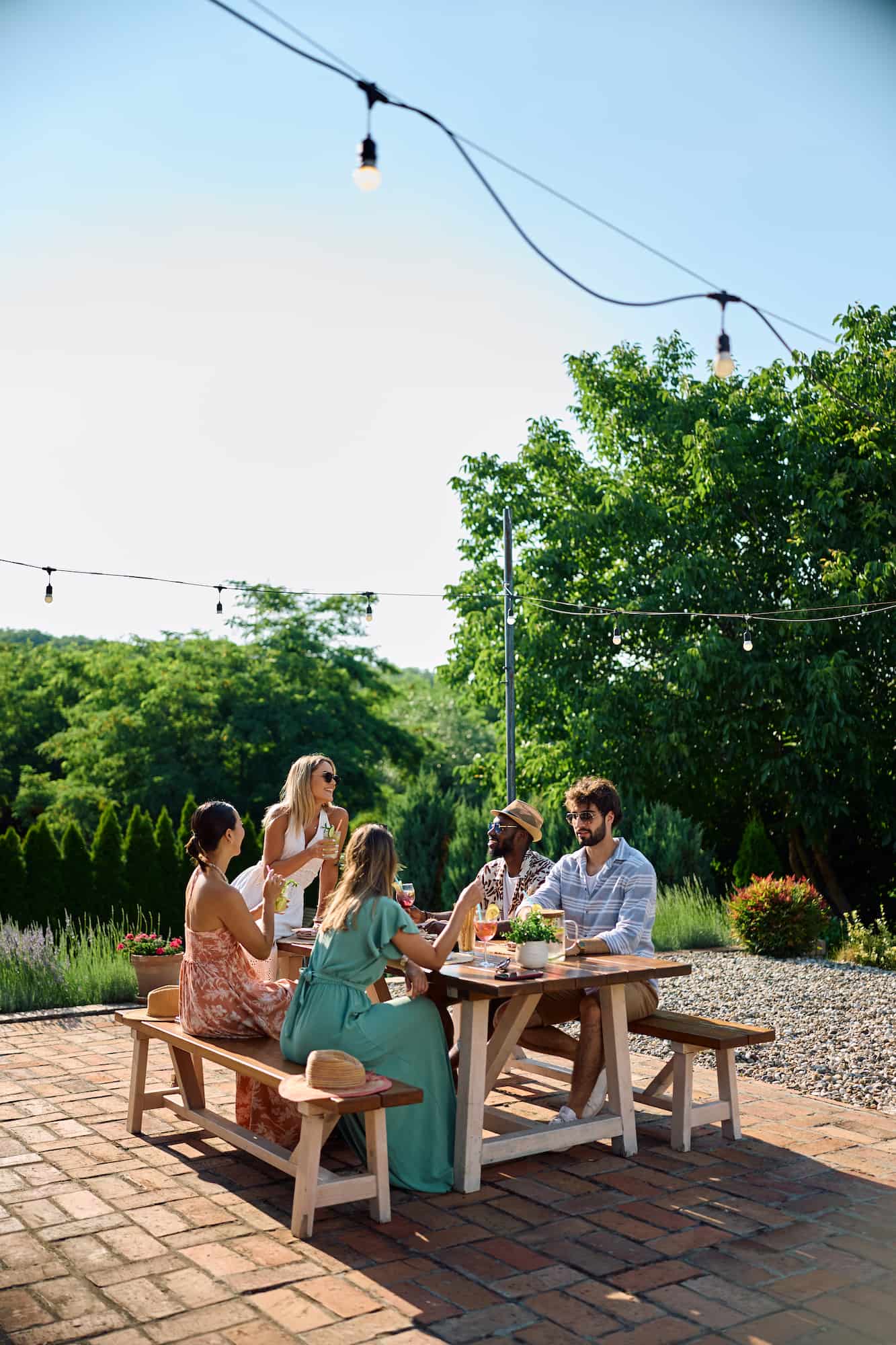 group-of-friends-enjoying-drinks-at-an-outdoor-pat-2026-07-14-20-44-26-utc