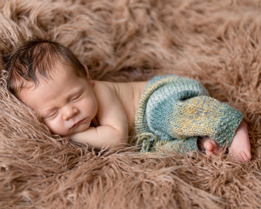 baby-sleeping-peacefully-on-fluffy-blanket-at-home-2026-03-25-00-23-23-utc