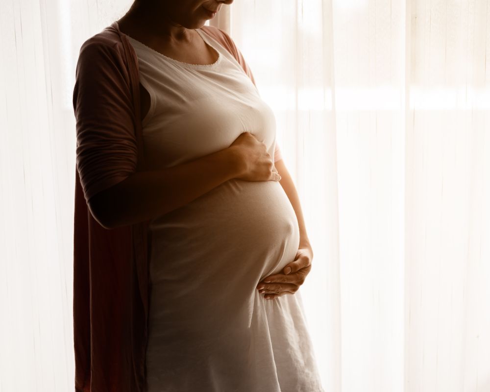 close-up-of-smile-pregnant-woman-with-big-belly-lo-2026-03-16-22-55-54-utc