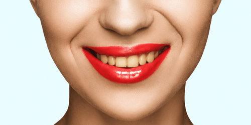 cropped-view-of-gorgeous-smiling-woman-with-red-li-2026-03-12-22-47-13-utc