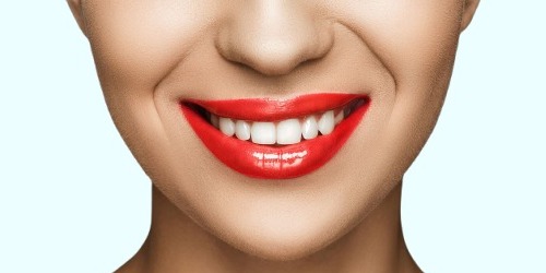 cropped-view-of-gorgeous-smiling-woman-with-red-li-2026-03-12-22-47-13-utc(1)